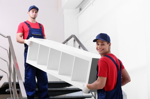 Moving team loading household items for a removals service