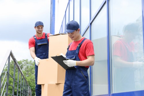 House removals planning in Roehampton with moving boxes and a van