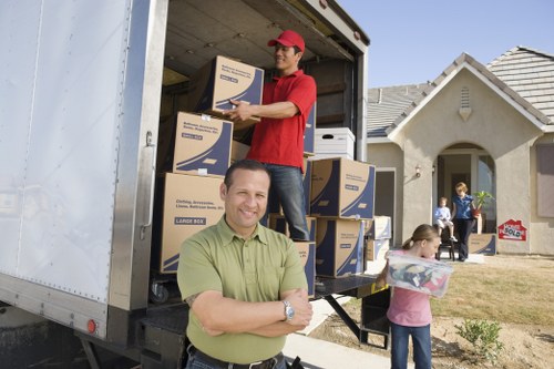 Urgent same day removals team loading a van in Roehampton
