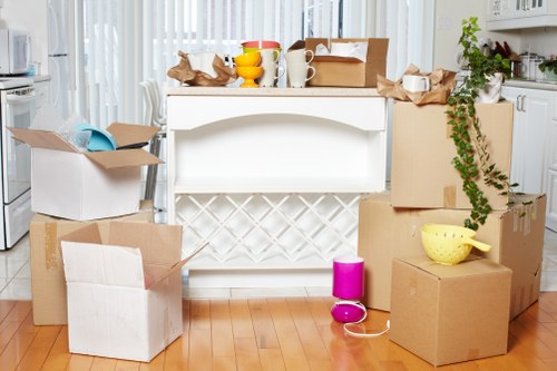 Movers disassembling a wardrobe during a local relocation