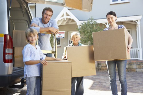 Packed boxes and moving equipment ready for same day removals