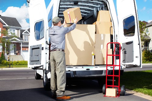 Organised moving team handling household belongings