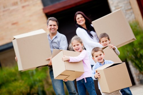 Professional movers handling furniture in Roehampton