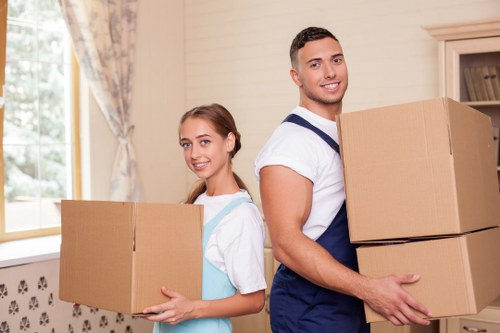 Professional movers preparing items for safe transport in Roehampton