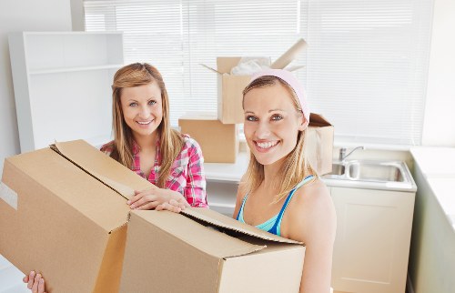 Professional movers handling furniture during a Roehampton relocation