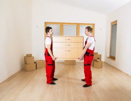 Packing boxes and loading items into a van for a Roehampton move